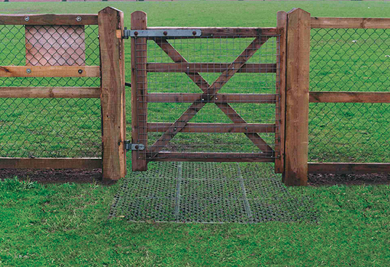 Gate Installation Stage 3 - Rubber Decking - Playground Surfacing - Soil Stabilization