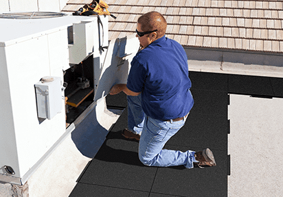 Worker kneeling on Walkway Pad