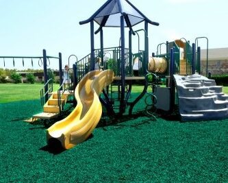 Green Premium Shredded Rubber Mulch on a Playground